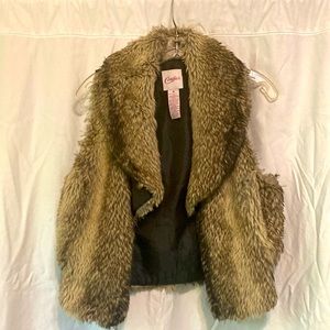Candie’s fur vest